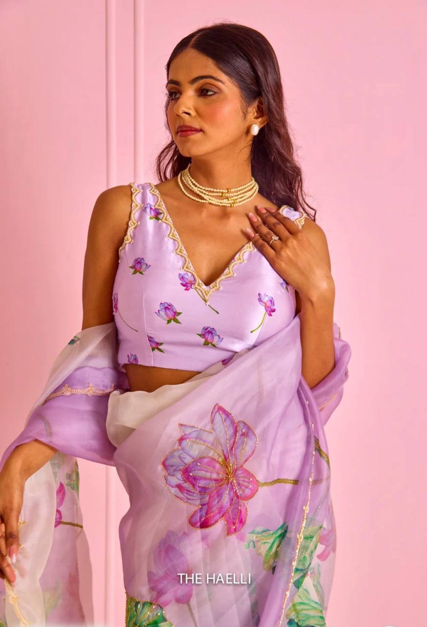 Women’s Exquisite Lavender & White Organza Saree with Hand-Painted Lotus Floral Motifs & Gold Embellished Border – Complete with Matching Printed Blouse for Festive & Special Occasions